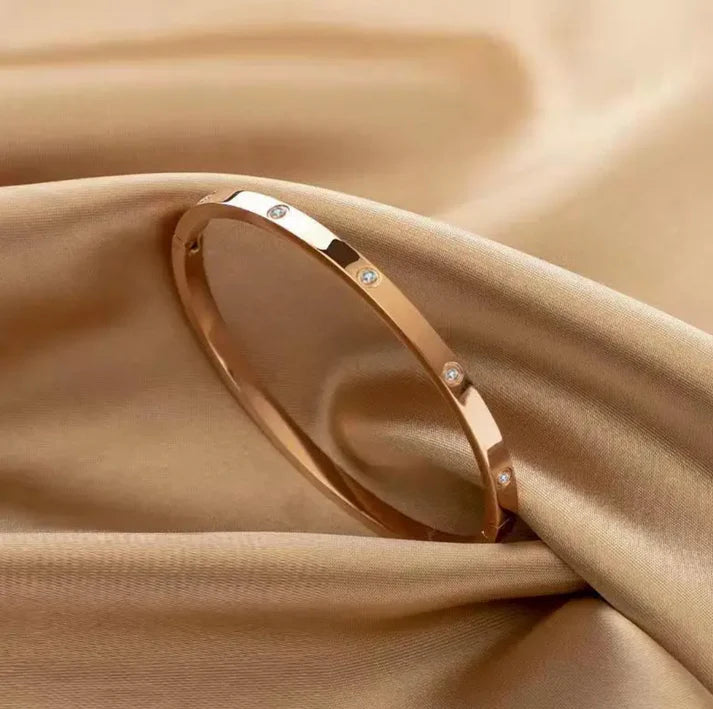 Gold plated bracelet with inlaid zircons