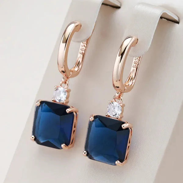 1+1 Offer: Elegant earrings with dark blue crystal in gold + Elegant Harmonious Necklace in Gold