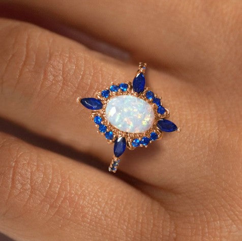Rose Gold Halo Oval Cut Opal & Blue Sapphire Engagement Ring