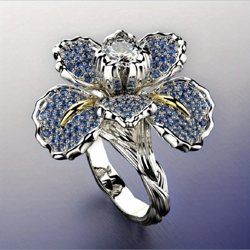 Silver ring with blue flower and crystal